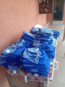 Distributing uniforms to pupils